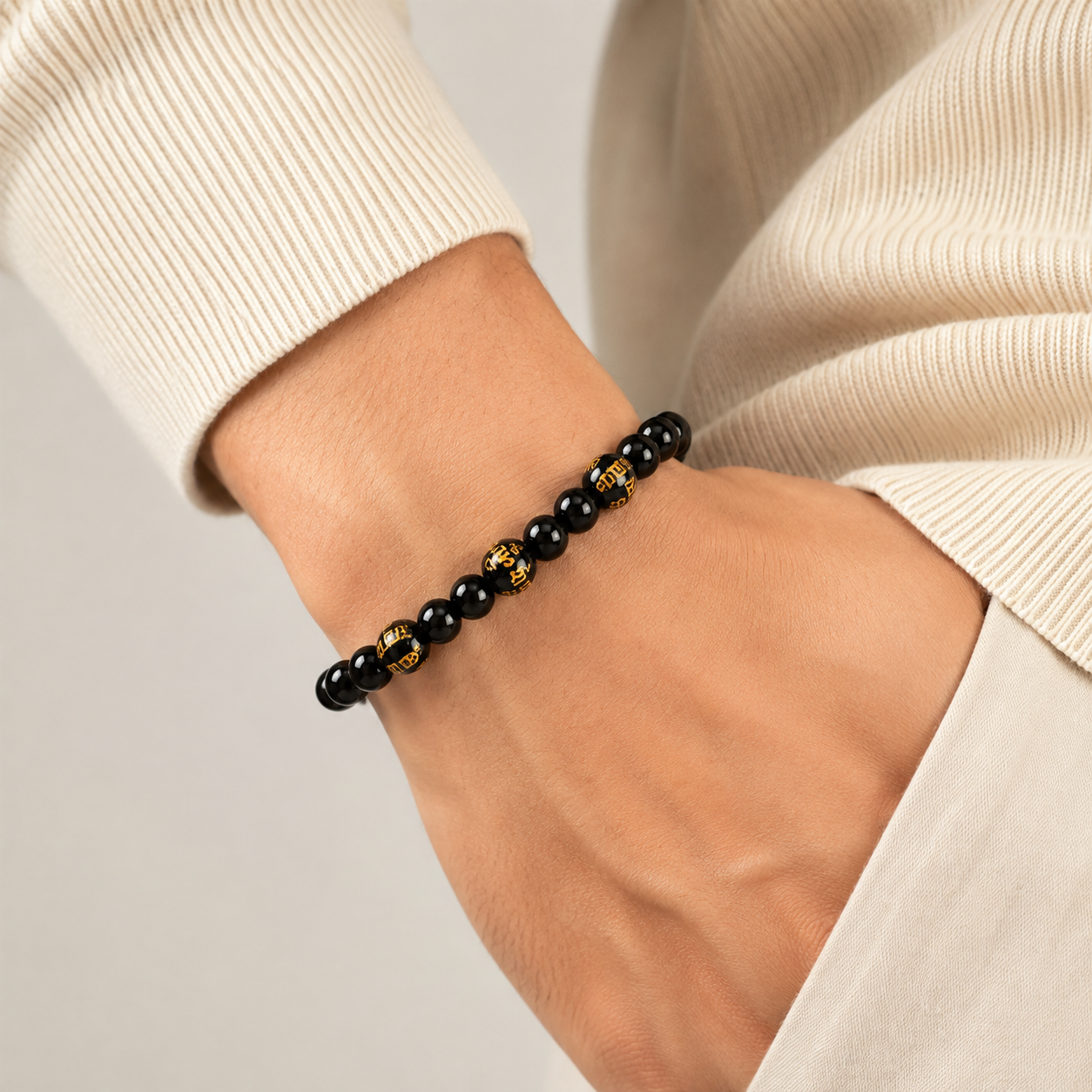 Black Onyx Bracelet with Shani Mantra — detail of the gold lettering — KaalVeda