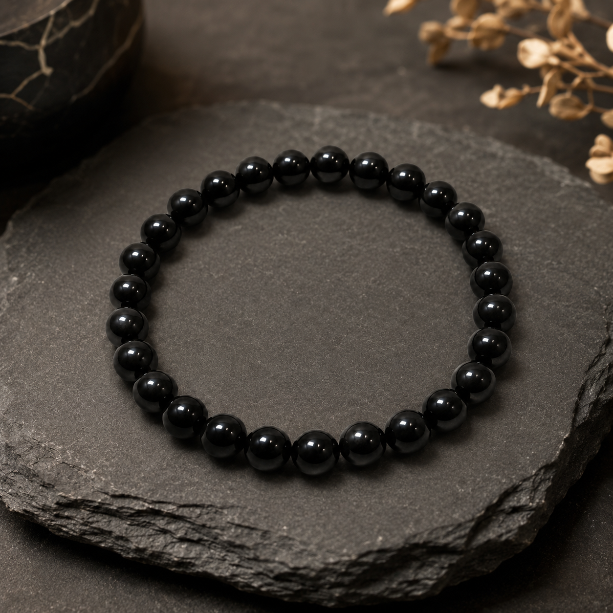 Black Tourmaline Bracelet — angled view of the polished beads — KaalVeda