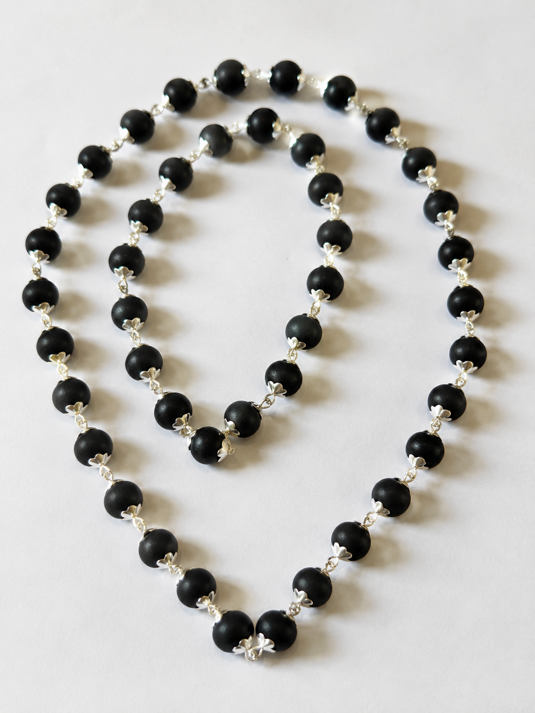 Silver-Capped Karungali Malai — black ebony beads with silver-tone caps — KaalVeda
